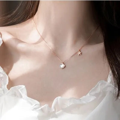 coastal charm necklace close-up pendant