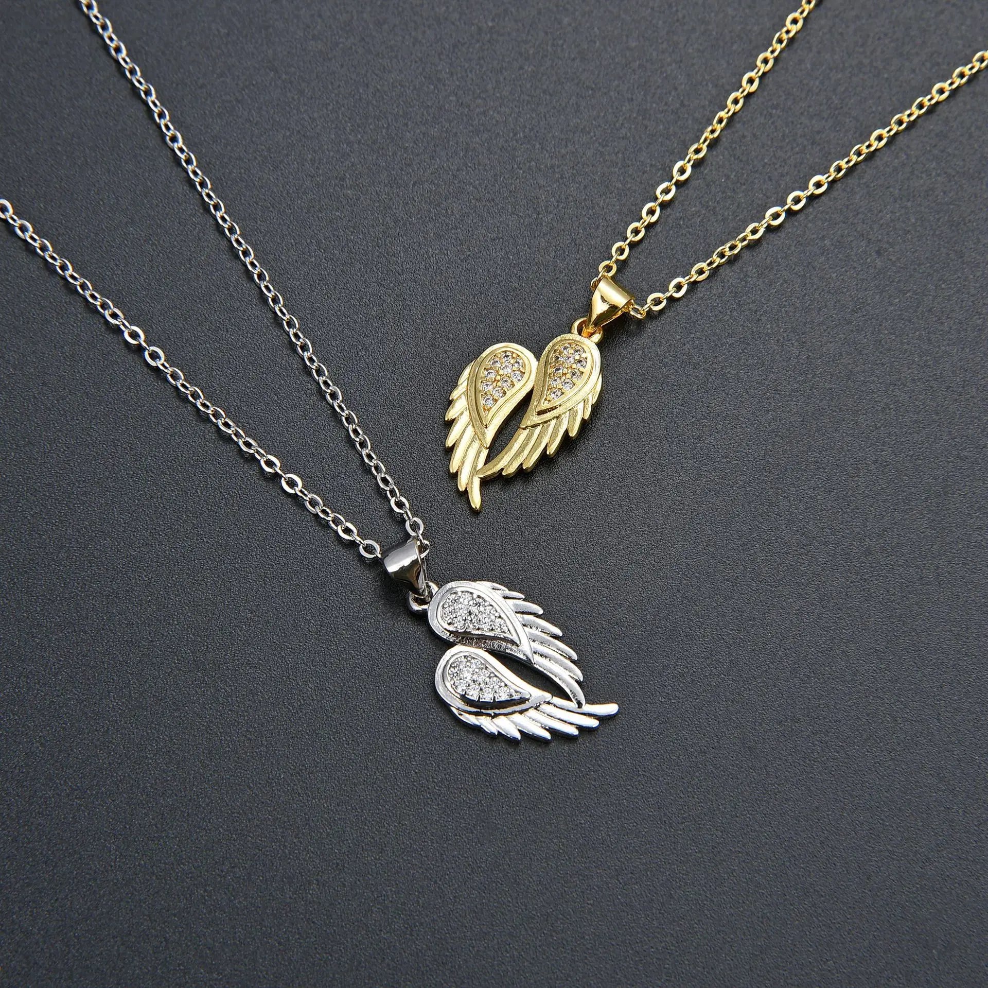 Winged Zircon Pendant Necklace in gold and silver featuring angel wing design with sparkling zircon stones, perfect for women’s elegant jewelry.