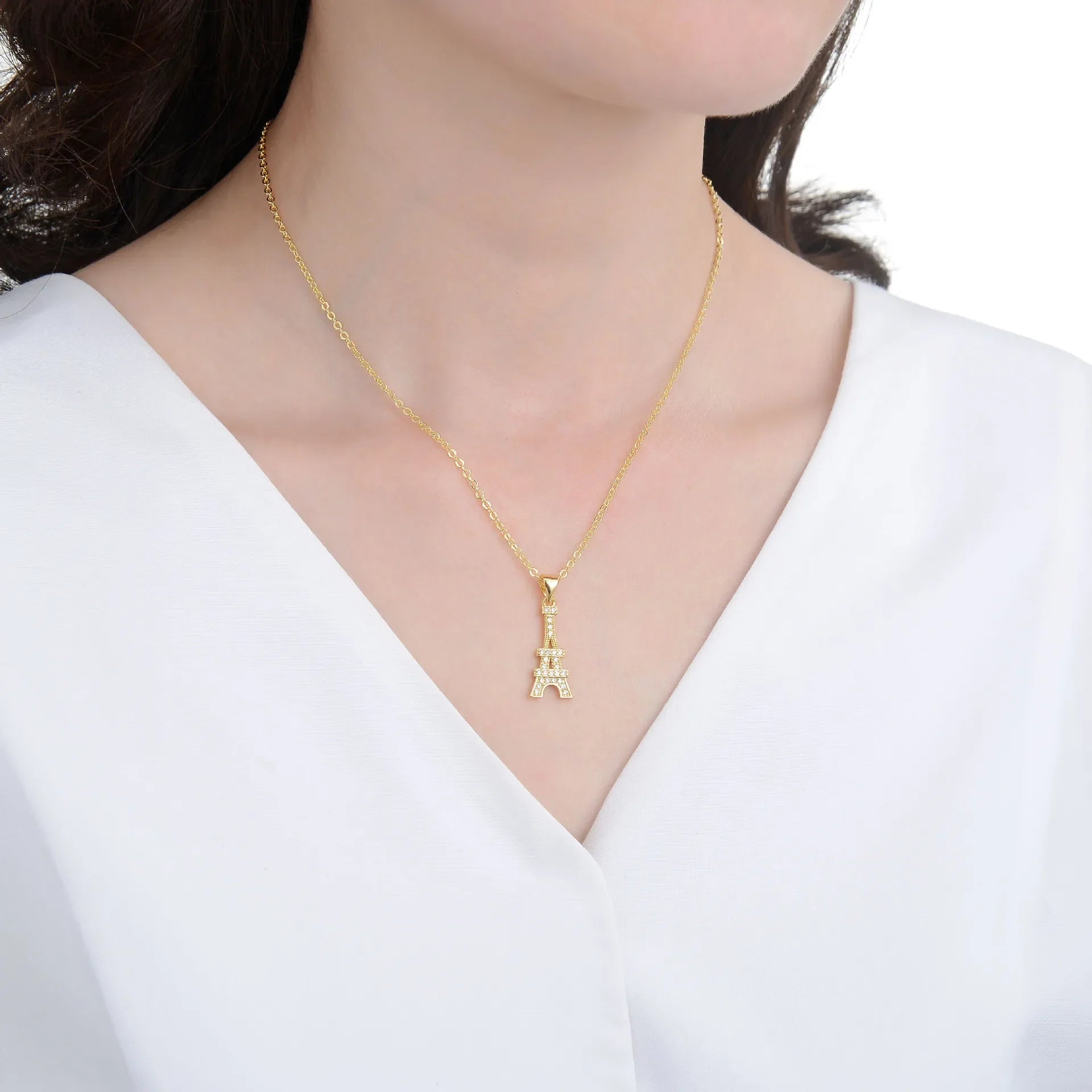 Eiffel Tower Pendant Necklace in gold and silver with crystal accents, an elegant Paris charm necklace for women in jewelry accessories.