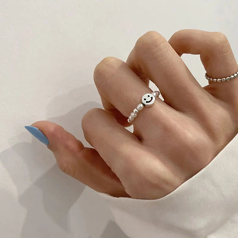 Adjustable Emerald Cut Pearl Stone Ring with silver-plated band and smiley face charm, ideal for casual wear and gifting in jewelry collections.