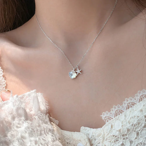 coastal charm necklace close-up pendant