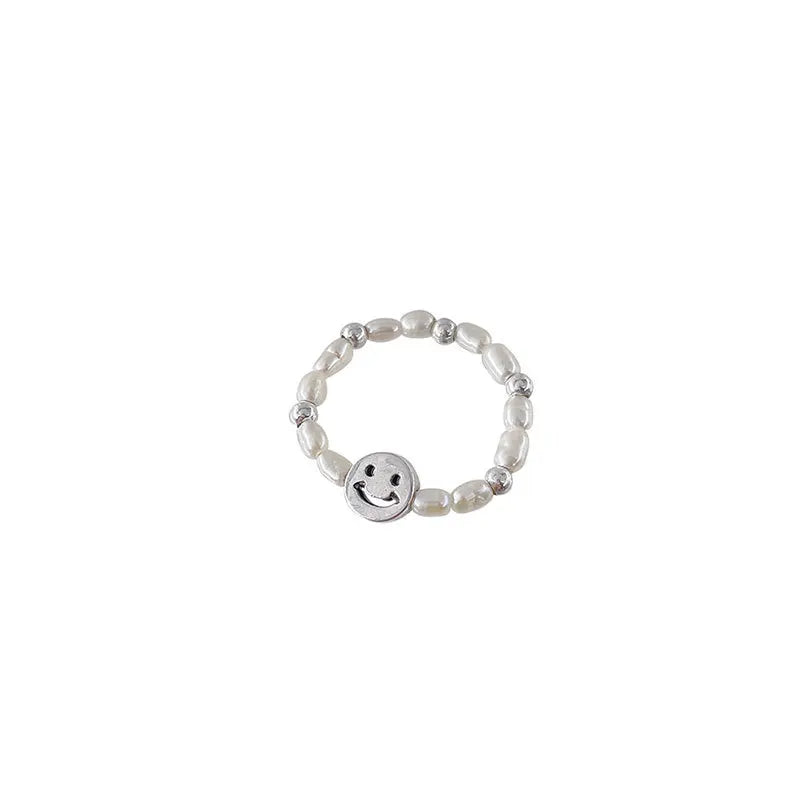 Adjustable Emerald Cut Pearl Stone Ring with silver-plated band and smiley face charm, ideal for casual wear and gifting in jewelry collections.