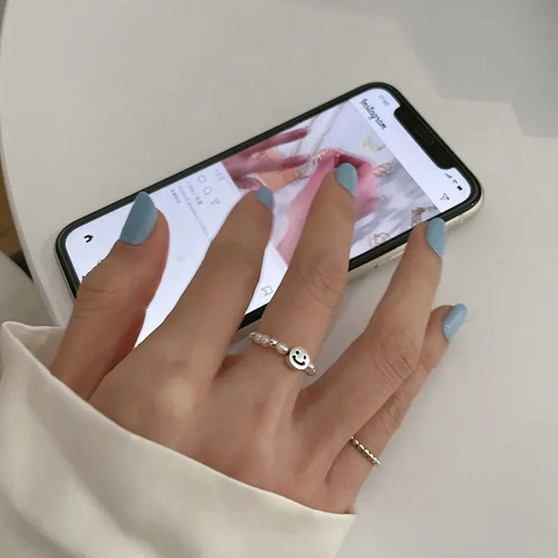 Adjustable Emerald Cut Pearl Stone Ring with silver-plated band and smiley face charm, ideal for casual wear and gifting in jewelry collections.