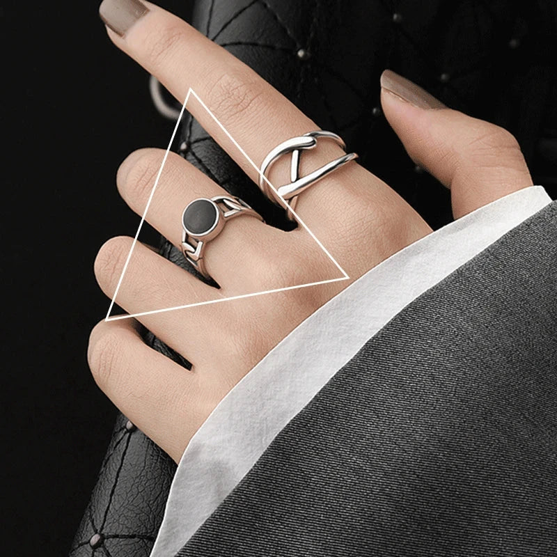 Adjustable Double Line Ring with minimalist open band design worn on woman's hand. Elegant silver tone ideal for chic everyday or party wear.