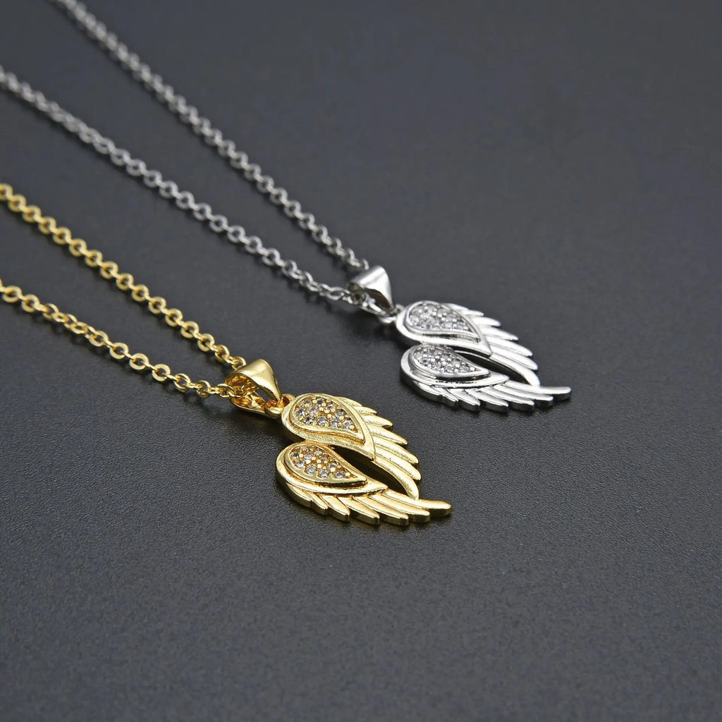 Winged Zircon Pendant Necklace in gold and silver featuring angel wing design with sparkling zircon stones, perfect for women’s elegant jewelry.