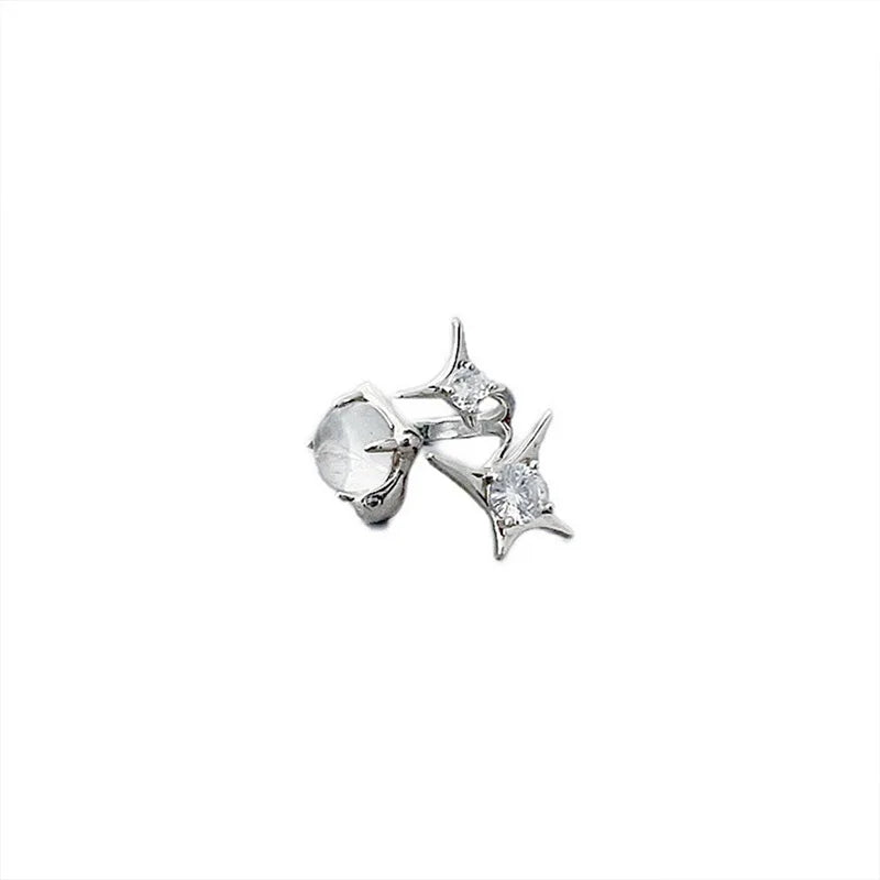 Shimmer Star Ring elegant adjustable star ring for women in silver, worn on hand with black sweater, ideal for stylish everyday jewelry.