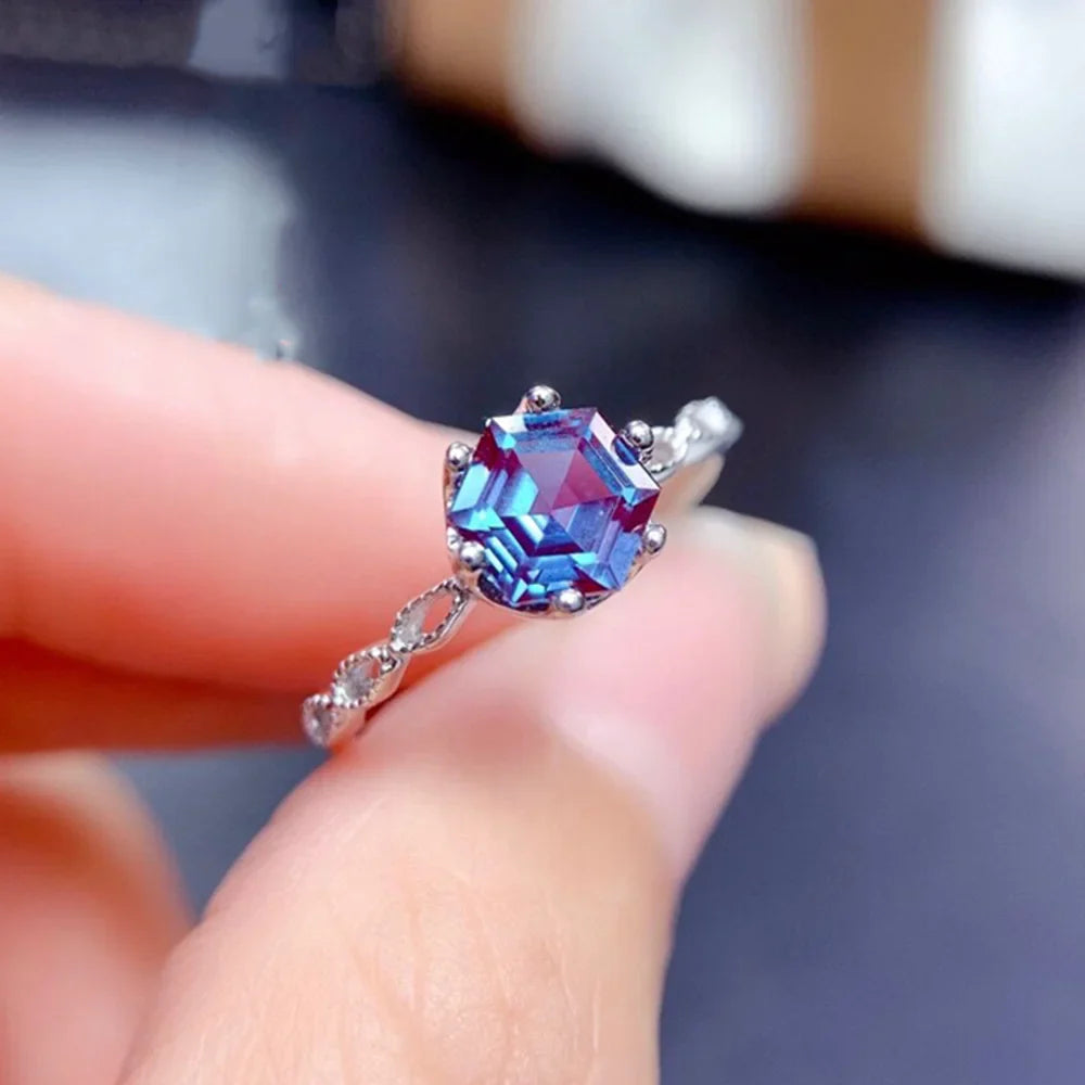 Alexandrite Sterling Silver Ring featuring a 6mm hexagon-cut gemstone in a prong setting. Elegant 925 silver band ideal for engagement occasions.