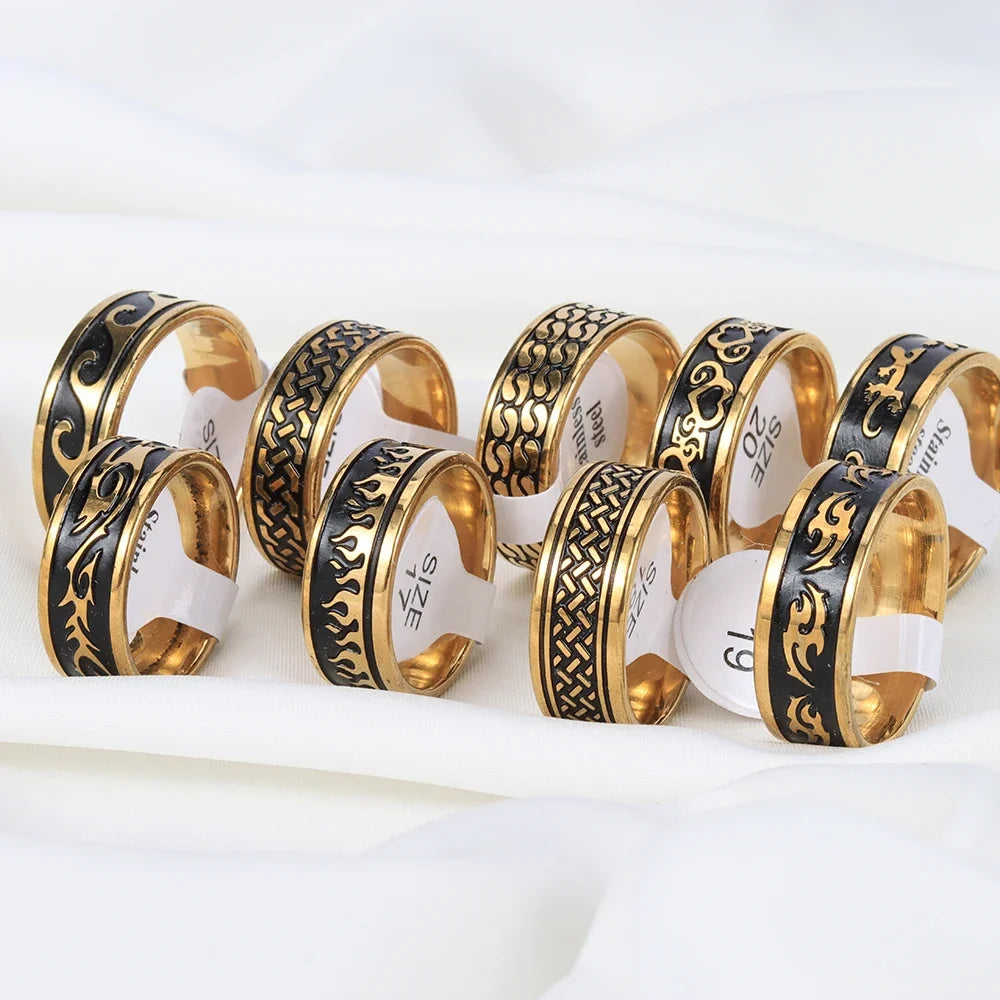 Retro vintage rings in stainless steel with black and gold finishes, ideal for wedding and bridal sets. Includes engraved and patterned designs.