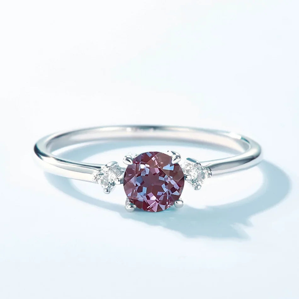 ALLNOEL Alexandrite Ring - Unique Engagement Band in sterling silver featuring color-changing Alexandrite stones in various elegant designs.
