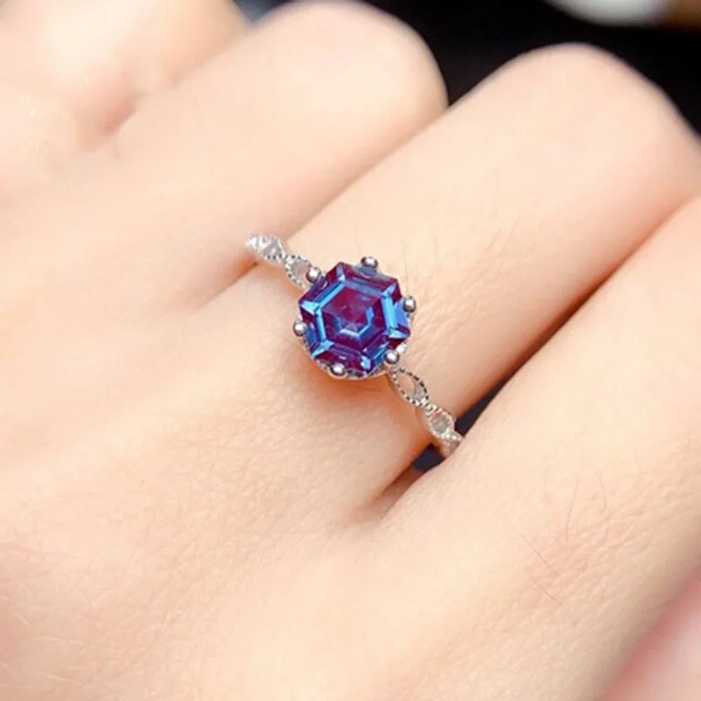 Alexandrite Sterling Silver Ring featuring a 6mm hexagon-cut gemstone in a prong setting. Elegant 925 silver band ideal for engagement occasions.