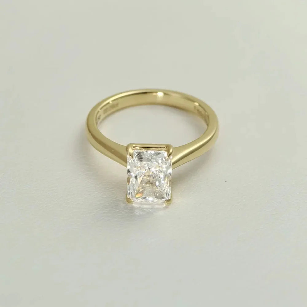 Radiant IGI Certified Diamond Ring in yellow gold setting, luxury engagement and bridal jewelry for weddings and special occasions.