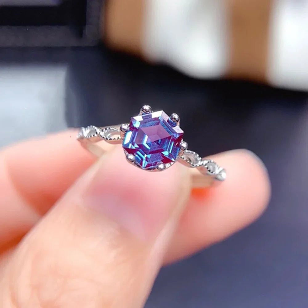 Alexandrite Sterling Silver Ring featuring a 6mm hexagon-cut gemstone in a prong setting. Elegant 925 silver band ideal for engagement occasions.