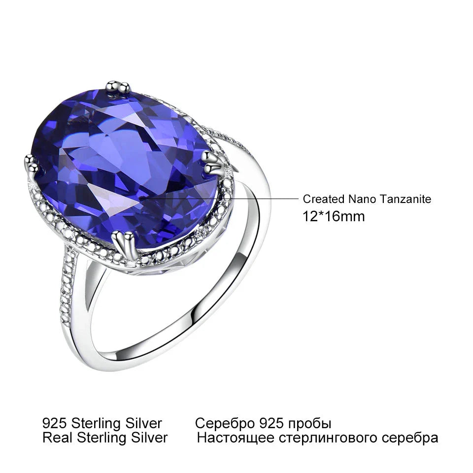 Elegant Silver Wedding Ring with round-cut Tanzanite Zircon on hand, showcasing fine jewelry craftsmanship for engagements or weddings.