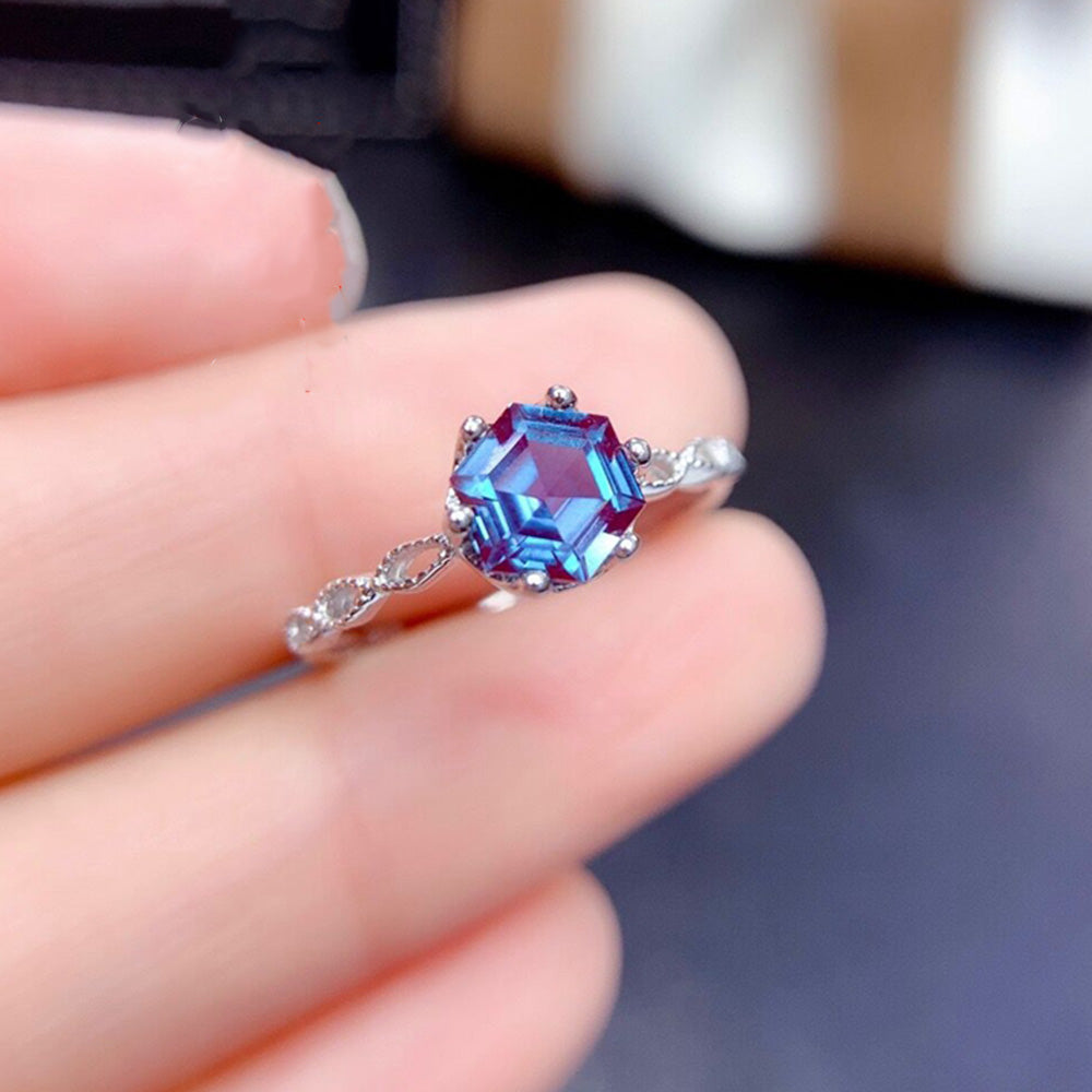Alexandrite Sterling Silver Ring featuring a 6mm hexagon-cut gemstone in a prong setting. Elegant 925 silver band ideal for engagement occasions.