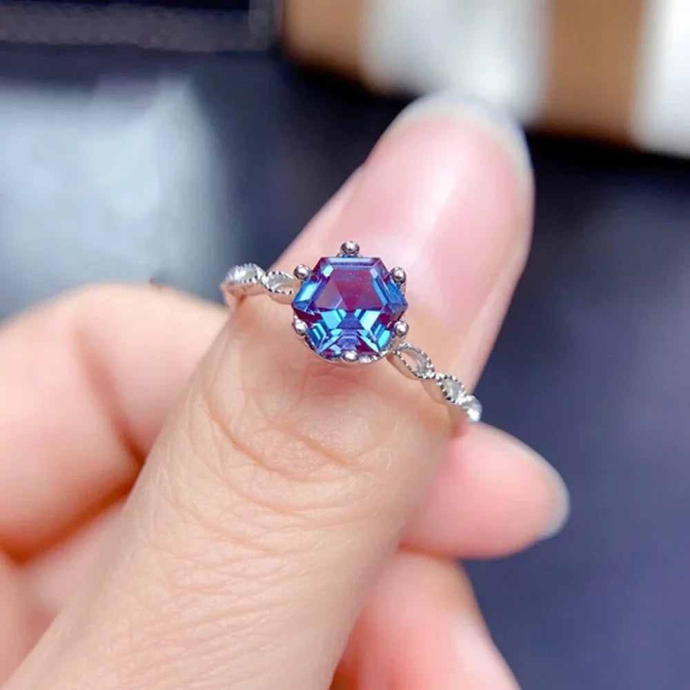 Alexandrite Sterling Silver Ring featuring a 6mm hexagon-cut gemstone in a prong setting. Elegant 925 silver band ideal for engagement occasions.