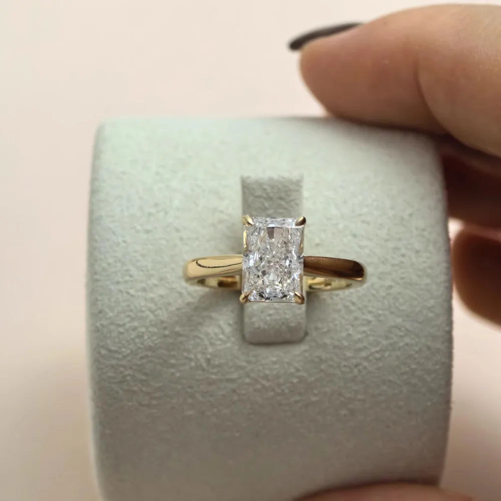 Radiant IGI Certified Diamond Ring in yellow gold setting, luxury engagement and bridal jewelry for weddings and special occasions.