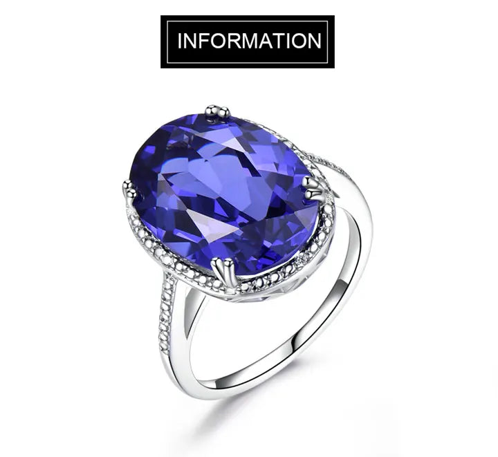 Elegant Silver Wedding Ring with round-cut Tanzanite Zircon on hand, showcasing fine jewelry craftsmanship for engagements or weddings.